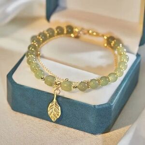 Elegant Glass Bead Bracelet with Golden-Tone Leaf Charm